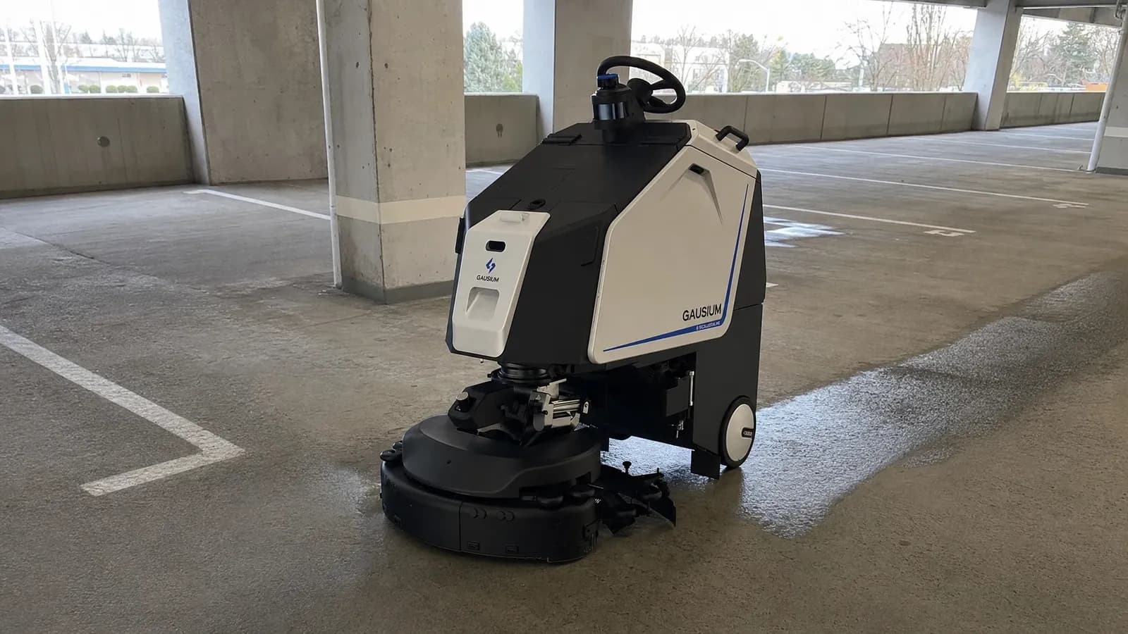 Gausium Scrubber 75 in a parking structure