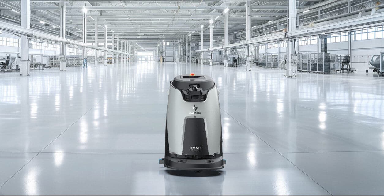 Gausium Omnie cleaning robot in large warehouse facility